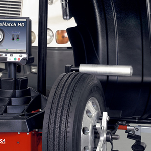 A tire machine with a tire mounted on it, ready for maintenance or repair.